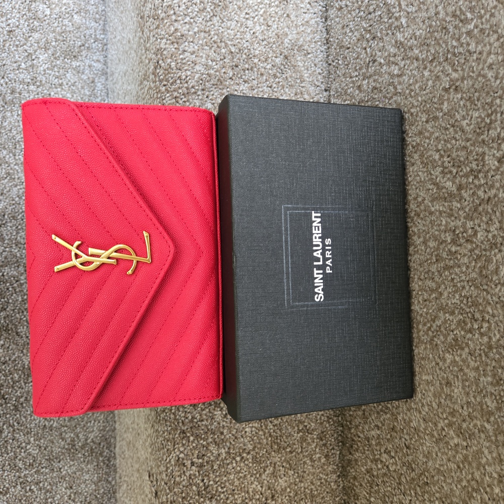 YSL Clutch with removable gold chain.